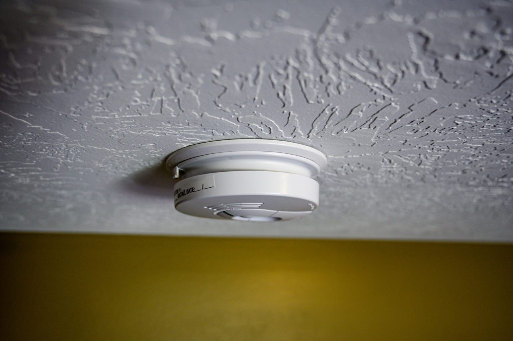 closeup shot of a ceiling-mounted smoke detector