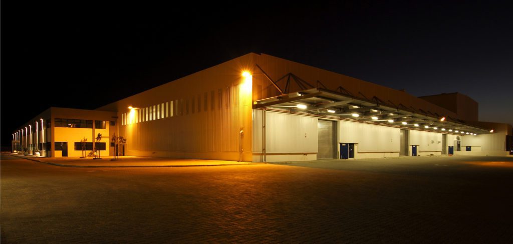 wide angle shot of a modern warehouse at night